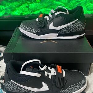 Nike Kids Black and White Sneakers with Orange Accents